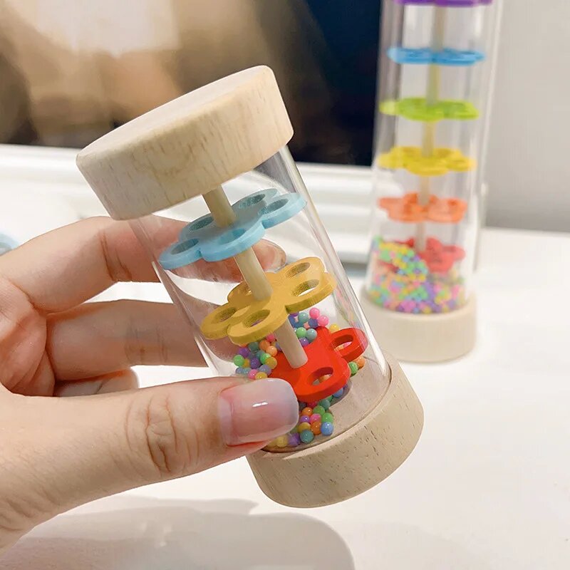 Kids Education Bell - ของเล่นจำลองเสียงฝน กระดิ่งทรายรูปนาฬิกาทรายสีรุ้ง เครื่องดนตรีเสริมพัฒนาการสำหรับเด็ก ของขวัญสำหรับเด็ก